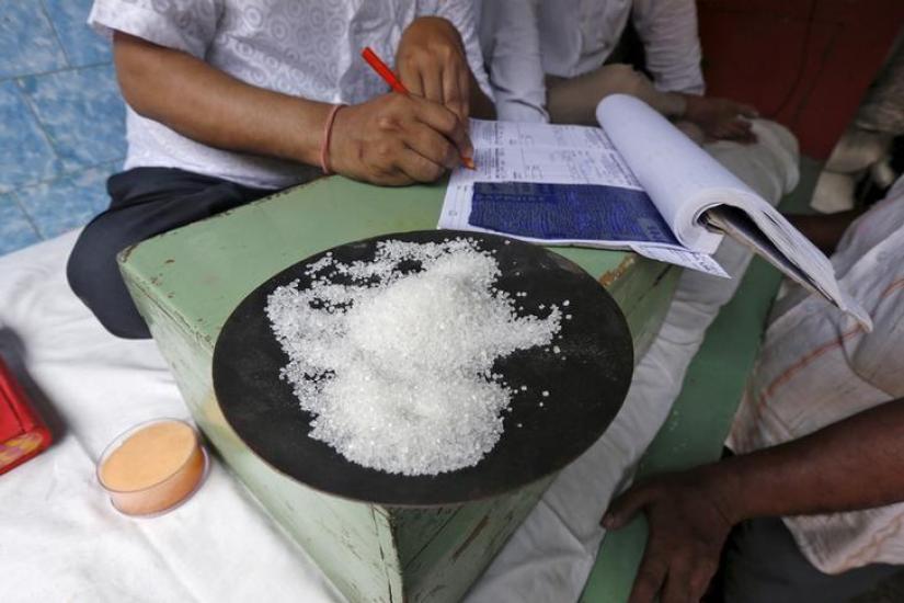 A sample of sugar crystals are seen on the desk of a trader at a wholesale market in Kolkata, India April 26, 2016. REUTERS/File Photo