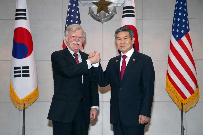 U.S. National Security Adviser John Bolton shakes hands with South Korean Defence Minister Jeong Kyeong-doo at the Defence Ministry in Seoul, South Korea, July 24, 2019. Yonhap via REUTERS