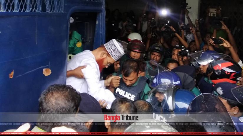 Delwar Hossain Sayeedi being escorted to court from a police van.