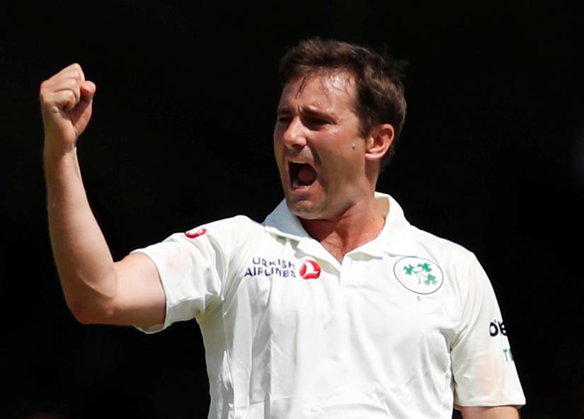 Cricket - Test Match - England v Ireland - Lord`s Cricket Ground, London, Britain - July 24, 2019 Ireland`s Tim Murtagh celebrates taking the wicket of England`s Chris Woakes Action Images via Reuters