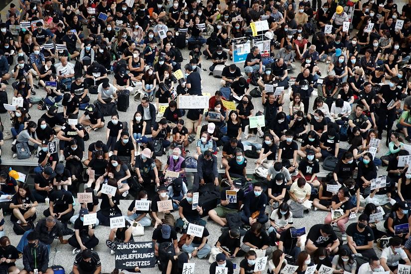 Protesters and members of the aviation industry stage a protest against the recent violence in Yuen Long, at Hong Kong airport, China July 26, 2019. REUTERS