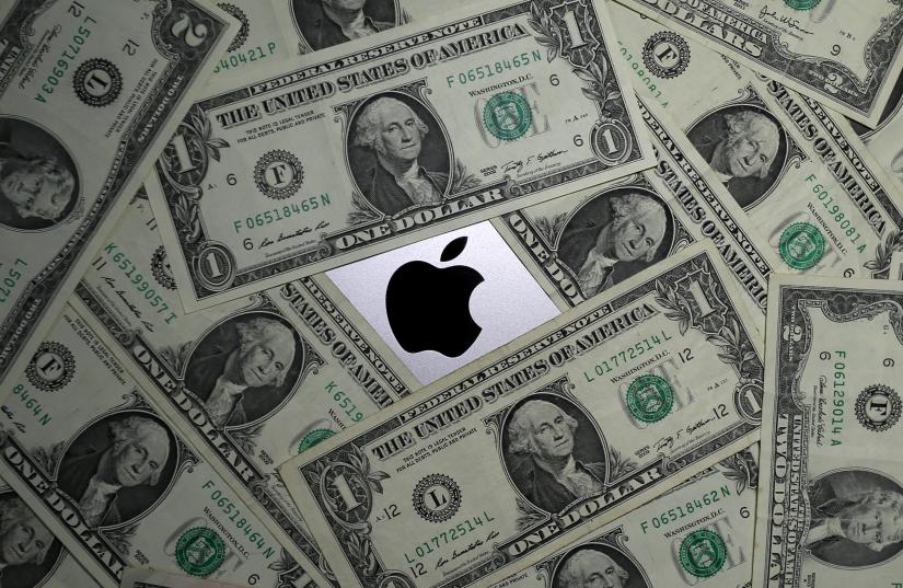 U.S. dollar banknotes and the Apple logo are seen in this photo illustration taken August 3, 2018. Photo illustration taken August 3, 2018. REUTERS/Illustration/File Photo