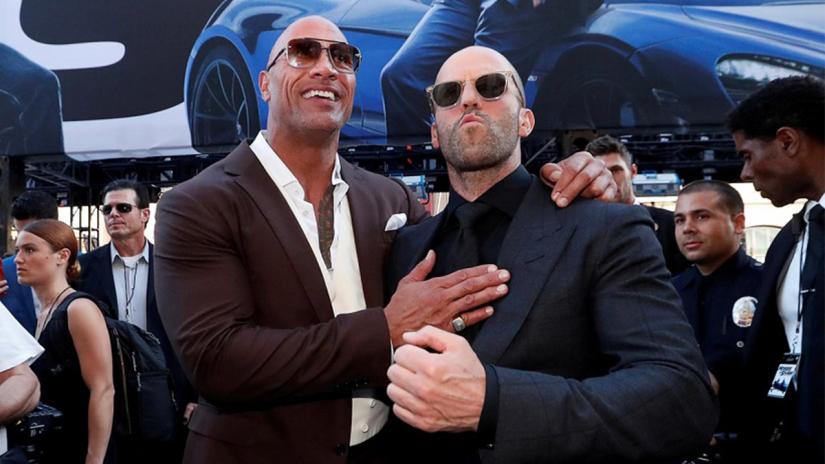 Cast members Dwayne Johnson and Jason Statham arrive at the premiere for `Fast & Furious Presents: Hobbs & Shaw` in Los Angeles, California, US, Jul 13, 2019. REUTERS/File Photo