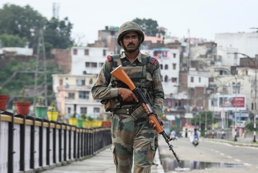 An Indian army soldier patrols on a bridge during restrictions in Jammu, August 5, 2019. REUTERS