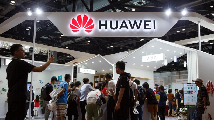 People look at products at the Huawei stall at the International Consumer Electronics Expo in Beijing, China Aug 2, 2019. REUTERS/FILE PHOTO