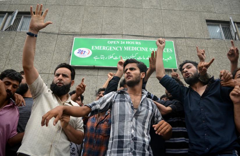 Demonstrators shout slogans outside a hospital emergency unit during a protest after the Indian government scrapped special status for Kashmir, in Srinagar August 9, 2019. REUTERS