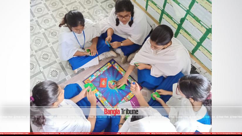 Students at Dhaka`s Ideal School and College are seen playing a game aimed at taking lessons about reproduction and sexual health.