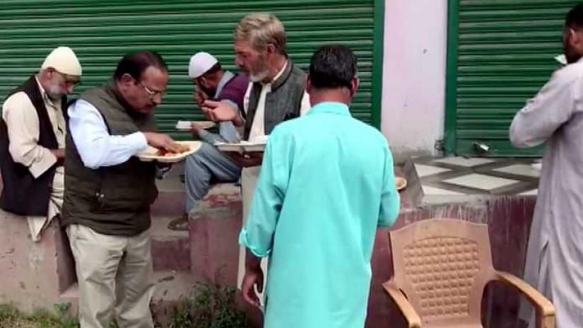 Modi`s NSA Ajit Doval interacting with locals in Shopian, Kashmir. Photo: ANI