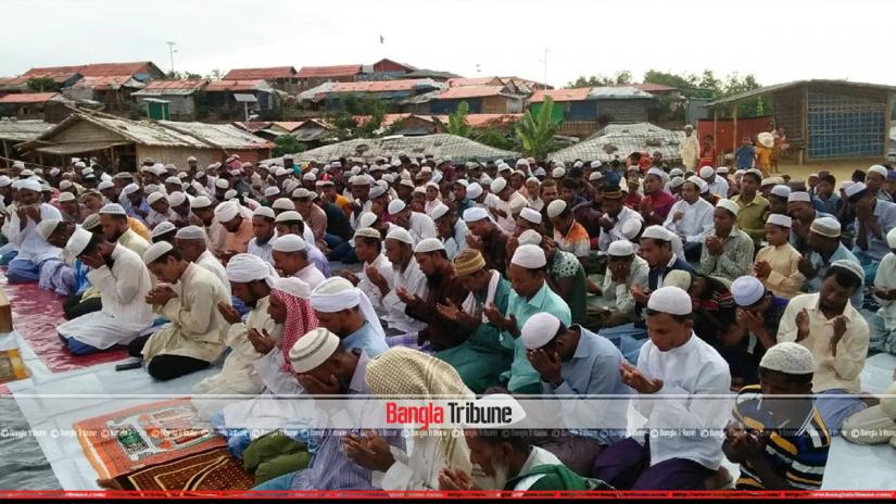 Rohingya Muslims are seen offering Eid payers on Monday (Aug 12).