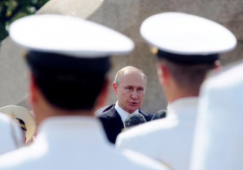 Russian President Vladimir Putin addresses the troops during the military parade during the Navy Day celebration in St.Petersburg, Russia, July 28, 2019. REUTERS/File Photo