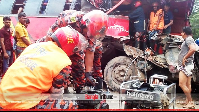 Fire service officials rescue the injured after two buses collided in Bogura.
