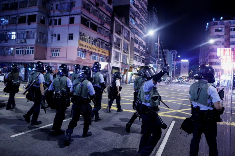 Police advance through the Sham Shui Po neighbourhood during clashes with anti-extradition bill protesters in Hong Kong, China, August 14, 2019. REUTERS