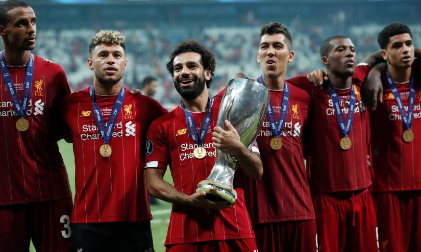 UEFA Super Cup - Liverpool v Chelsea - Vodafone Arena, Istanbul, Turkey - August 14, 2019 Liverpool`s Mohamed Salah with team mates as he celebrates winning the UEFA Super Cup with the trophy REUTERS