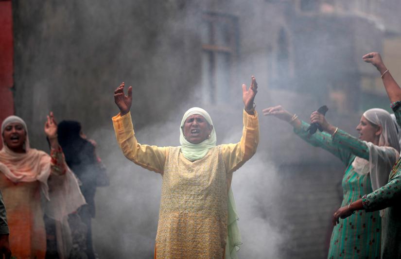 Women shout slogans during a protest following restrictions after the government scrapped the special constitutional status for Kashmir, in Srinagar August 14, 2019. REUTERS