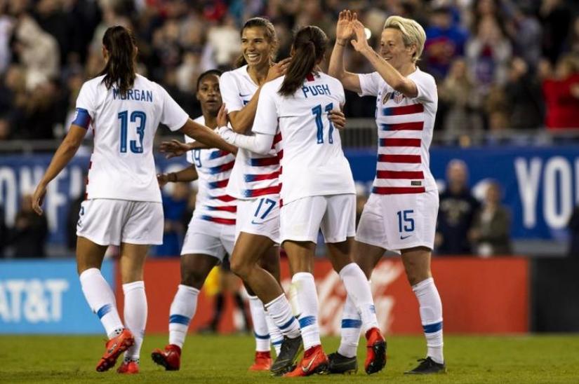 Mar 5, 2019; Tampa, FL, USA; United States forward Tobin Heath (17) and forward Alex Morgan (13) and forward Mallory Pugh (11) celebrate after a goal during the first half against Brazil during a She Believes Cup women`s soccer match at Raymond James Stadium.