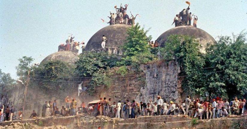 A mob of Hindu zealots surround the Babri Masjid in Ayodhya which was demolished on Dec 6, 1992. COURTESY