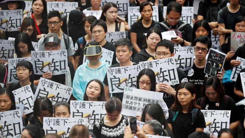 Teachers protest against the extradition bill during a rally organised by Hong Kong Professional Teachers` Union in Hong Kong, China Aug 17, 2019. REUTERS