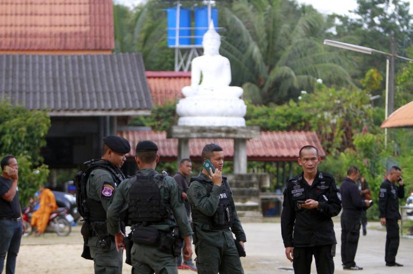 Military police officers are seen at a temple where unknown gunmen shot dead two Buddhist monks and injured two others on Friday in Su-ngai Padi district in the southern province of Narathiwat, Thailand, January 19, 2019. REUTERS