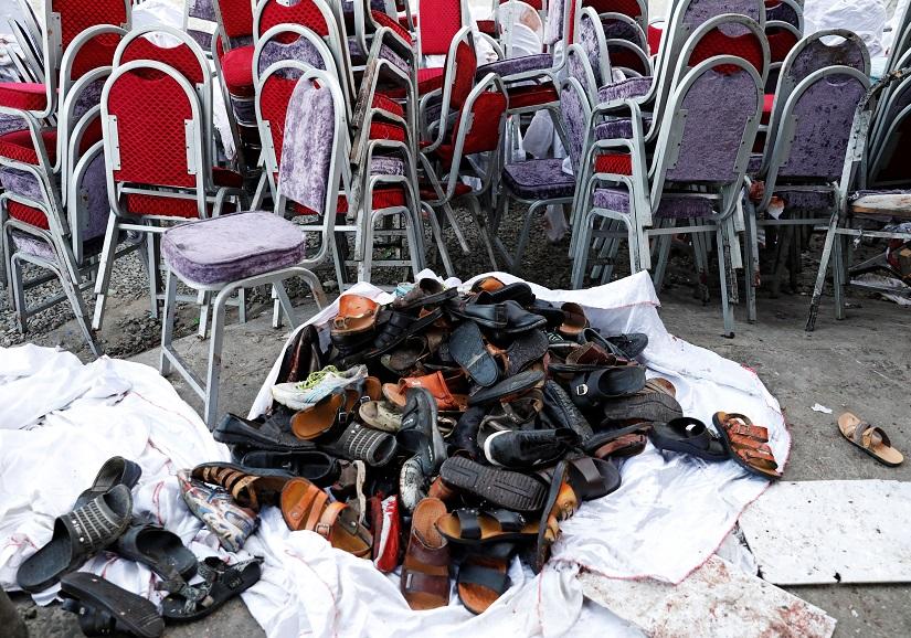 The shoes of victims are seen outside a damaged wedding hall after a blast in Kabul, Afghanistan August 18, 2019.REUTERS