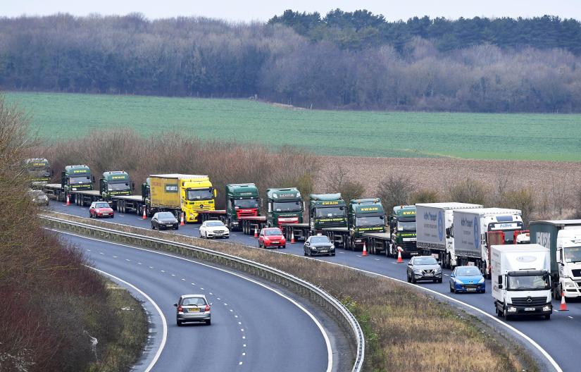 FILE PHOTO: A line of lorries is seen during a trial between disused Manston Airport and the Port of Dover of how road will cope in case of a `no-deal` Brexit, Kent, Britain January 7, 2019. REUTERS/File Photo