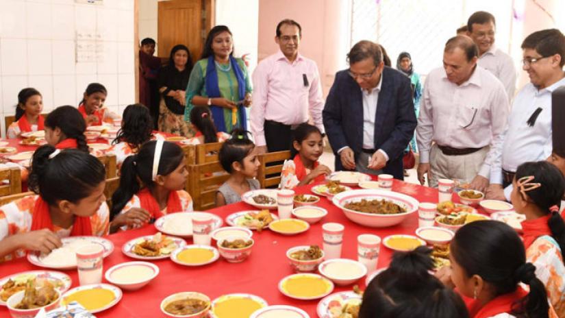 Law, Justice and Parliamentary Affairs Minister Anisul Huq serving improved diet among children of Government Shishu Paribar marking 44th martyrdom anniversary of Father of the Nation Bangabandhu Sheikh Mujibur Rahman and the National Mourning Day in capital’s Tejgaon area on Aug 19, 2019. BSS