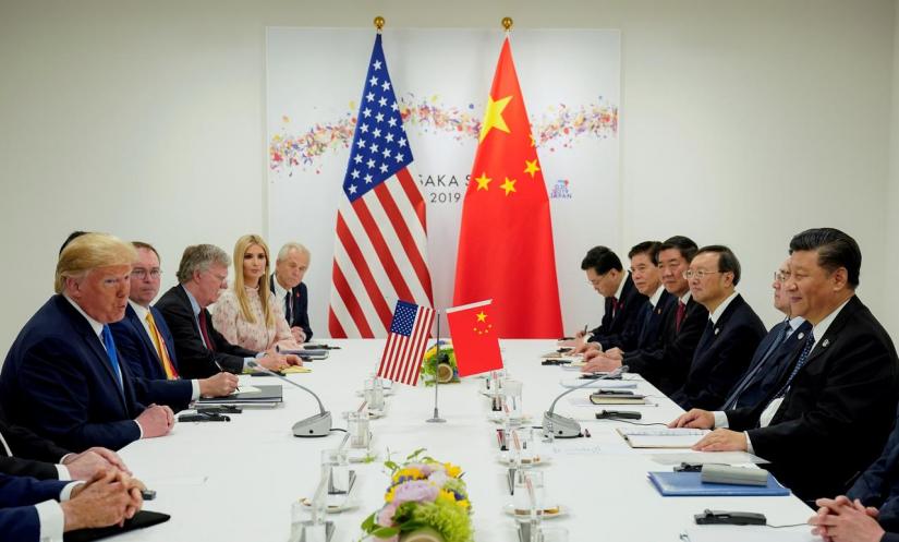 FILE PHOTO: US President Donald Trump meets with China`s President Xi Jinping at the start of their bilateral meeting at the G20 leaders summit in Osaka, Japan, June 29, 2019. REUTERS