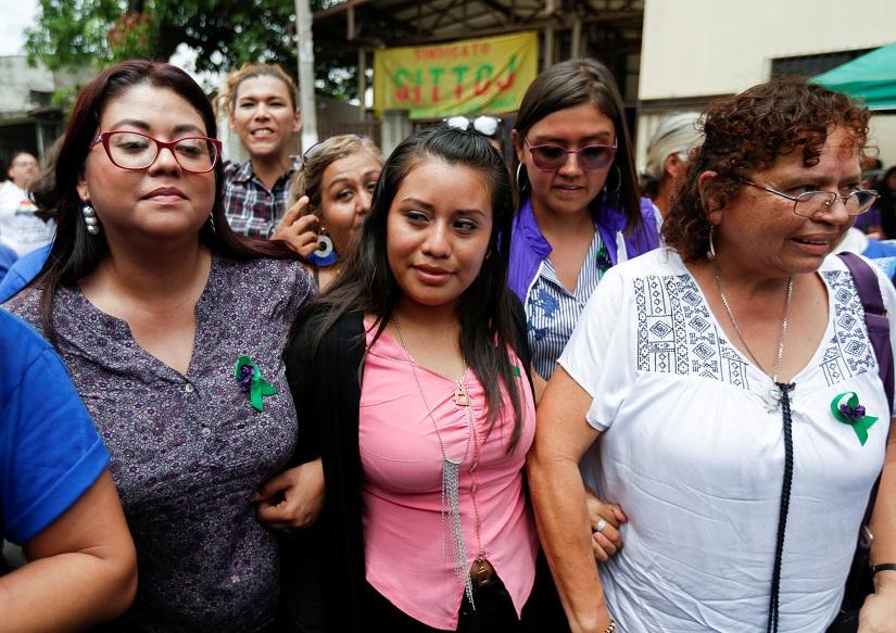 Evelyn Hernandez, who was sentenced to 30 years in prison for a suspected abortion, leaves with Salvadoran feminist and social activist Morena Herrera and attorney Angelica Rivas after being absolved at a hearing in Ciudad Delgado, El Salvador August 19, 2019. REUTERS