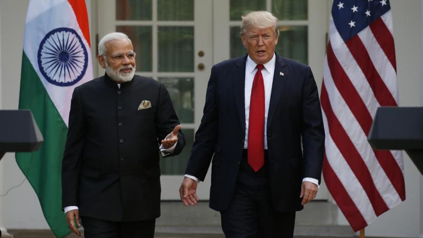 FILE PHOTO: US President Donald Trump (R) arrives for a joint news conference with Indian Prime Minister Narendra Modi in the Rose Garden of the White House in Washington, US, Jun 26, 2017. REUTERS