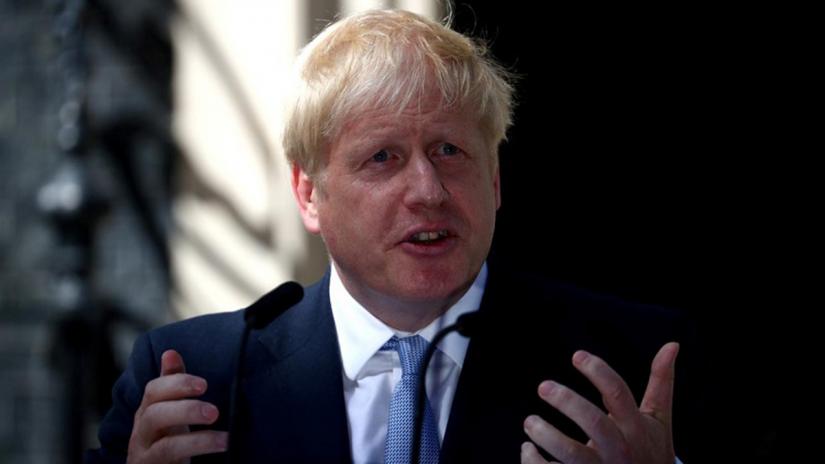 FILE PHOTO: Britain`s Prime Minister Boris Johnson delivers a speech outside Downing Street in London, Britain Jul 24, 2019. REUTERS
