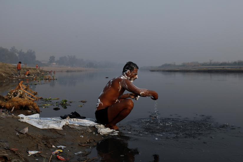 A man bathes in the polluted waters of the Yamuna river in New Delhi, India, October 25, 2018. REUTERS/File Photo