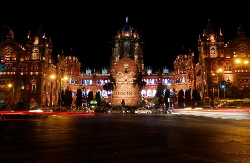 Traffic moves in front of the Chhatrapati Shivaji Terminus (CST), formerly known as Victoria Terminus, before the lights were turned off for Earth Hour in Mumbai, India, March 25, 2017. REUTERS