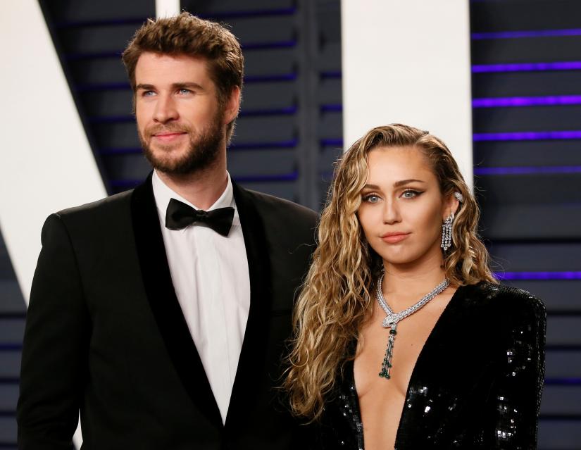 FILE PHOTO: 91st Academy Awards – Vanity Fair – Beverly Hills, California, U.S., February 24, 2019 – Liam Hemsworth and Miley Cyrus. REUTERS
