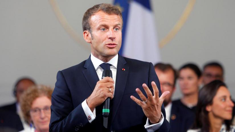 French President Emmanuel Macron delivers a speech on environment and social equality to business leaders on the eve of the G7 summit in Paris, France Aug 23, 2019. Pool via REUTERS