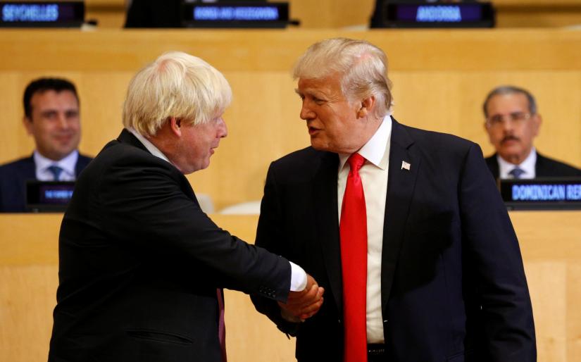 US President Donald Trump shakes hands with British Foreign Secretary Boris Johnson (L) as they take part in a session on reforming the United Nations at U.N. Headquarters in New York, U.S., September 18, 2017. REUTERS/File Photo