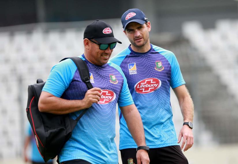Bangladesh`s head coach Russell Domingo (L), and fielding consultant Ryan Cook