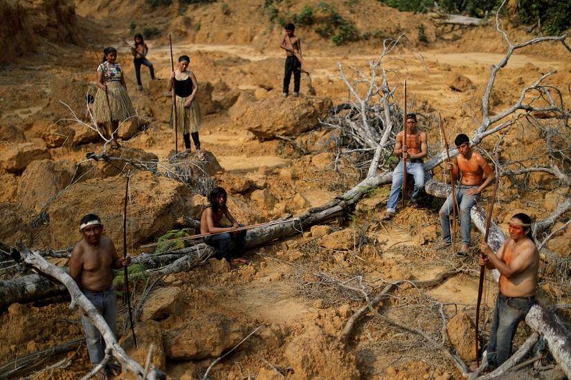 Indigenous people from the Mura tribe show a deforested area in unmarked indigenous lands inside the Amazon rainforest near Humaita, Amazonas State, Brazil Aug 20, 2019. REUTERS/FILE PHOTO