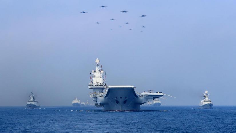 FILE PHOTO - Warships and fighter jets of Chinese People`s Liberation Army (PLA) Navy take part in a military display in the South China Sea Apr 12, 2018. REUTERS