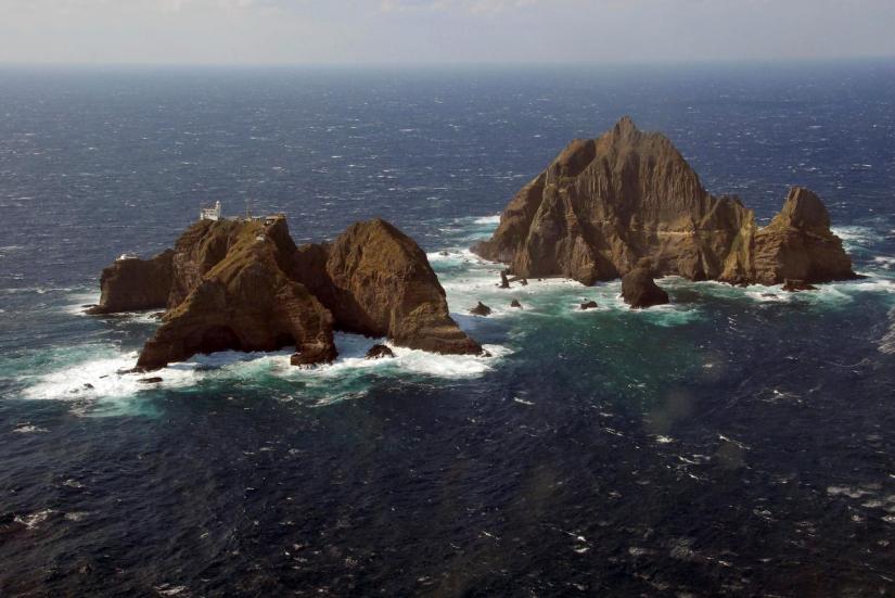 FILE PHOTO: An aerial view shows a part of the group of islets known in South Korea as Dokdo and in Japan as Takeshima in the Sea of Japan, Oct 20, 2007. REUTERS