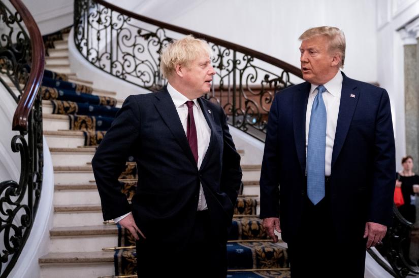 US President Donald Trump and Britain`s Prime Minister Boris Johnson arrive for a bilateral meeting during the G7 summit in Biarritz, France, August 25, 2019. Pool via REUTERS