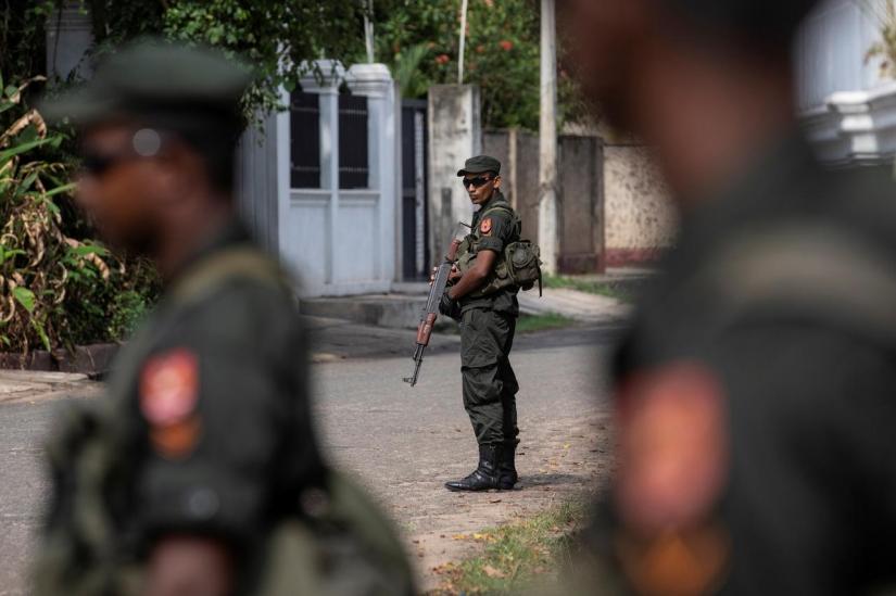 FILE PHOTO: Soldiers stand guard outside St. Sebastian Church, days after a string of suicide bomb attacks across the island on Easter Sunday, in Negombo, Sri Lanka, May 1, 2019. REUTERS
