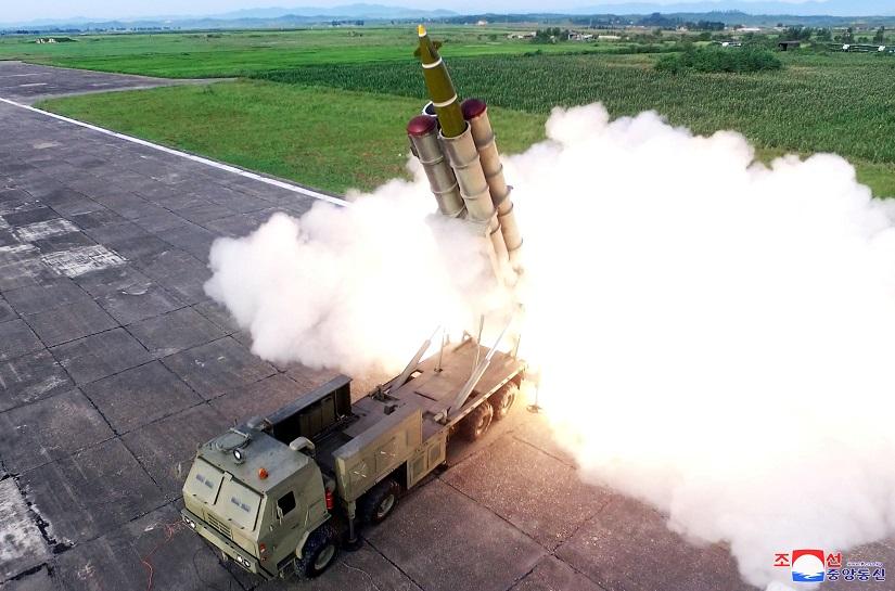 A missile is fired during the test of a multiple rocket launcher in this undated photo released on August 25, 2019 by North Korea`s Korean Central News Agency (KCNA). KCNA via REUTERS