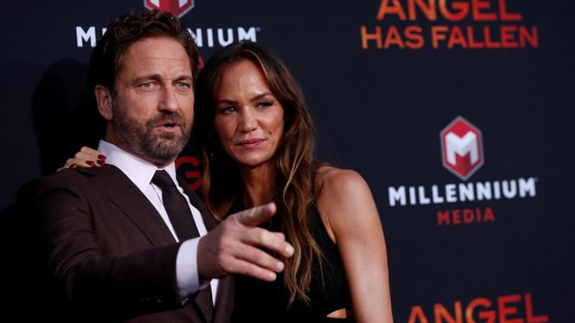 FILE PHOTO: Gerard Butler and Morgan Brown attend the premiere for the film “Angel Has Fallen” in Los Angeles, California, US, Aug 20, 2019. REUTERS