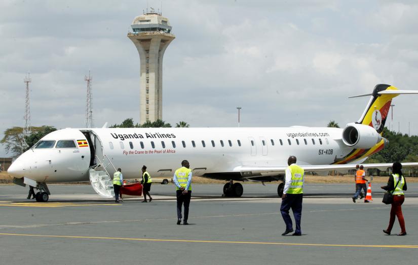 FILE PHOTO: Passengers disembark from a Uganda Airlines Bombardier CRJ-900 plane during its relaunching flight to Jomo Kenyatta International Airport in Nairobi, Kenya August 27, 2019. REUTERS