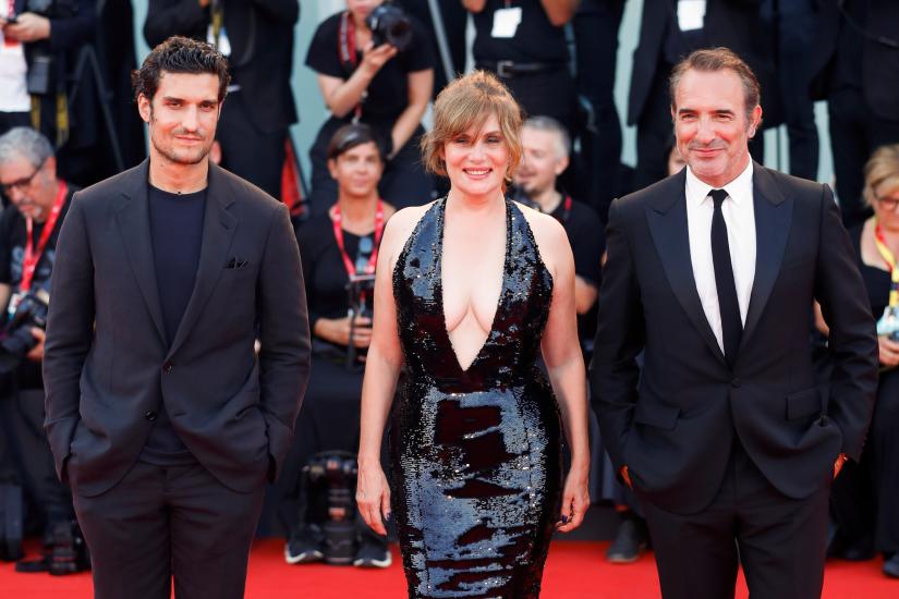 The 76th Venice Film Festival - Screening of the film `An Officer and a Spy` in competition - Red Carpet Arrivals - Venice, Italy, August 30, 2019 - Actors Jean Dujardin, Emmanuelle Seigner and Louis Garrel pose. REUTERS