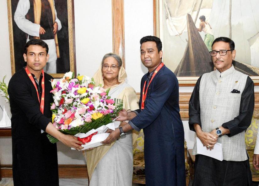 Bangladesh Chhatra league`s new President Rejwanul Haque Choudhury Shovon and General Secretary Golam Rabbani greet Prime Minister and Awami League chief Sheikh Hasina with a bouquet before a meeting at Ganabhaban on Wednesday, August 1, 2018 Focus Bangla