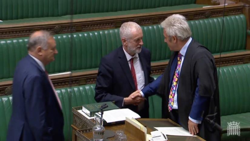 Britain`s opposition Labour party leader Jeremy Corbyn shakes hands with Speaker John Bercow after parliament voted on whether to hold an early general election, in Parliament in London, Britain, September 10, 2019, in this still image taken from Parliament TV footage. Parliament TV via REUTERS