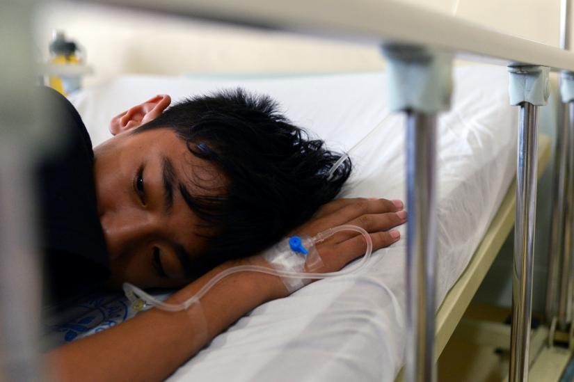 A boy recuperates from dengue fever in a hospital of Manila, Philippines, August 23, 2019. REUTERS