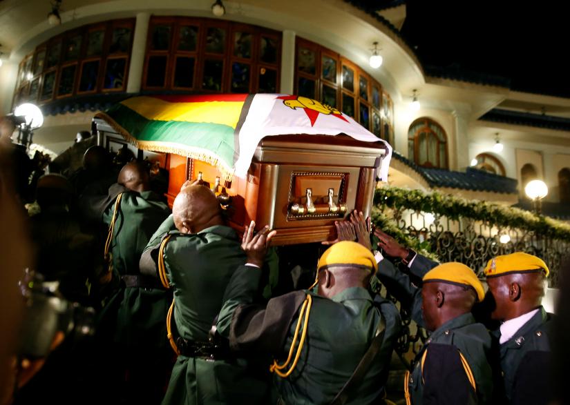 The body of former Zimbabwean President Robert Mugabe arrives at the `Blue Roof`, his residence in Borrowdale, Harare, Zimbabwe, September 11, 2019. REUTERS