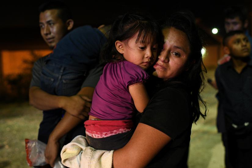 A Guatemalan migrant with her two year-old daughter after turning  themselves to U.S. Border Patrol to seek asylum after illegally crossing the Rio Grande in Hidalgo, Texas, U.S., August 23, 2019. Picture taken August 23, 2019. REUTERS