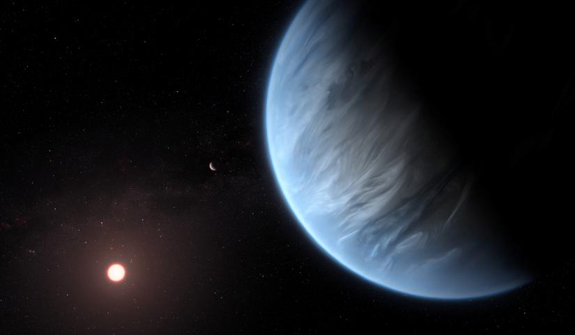 An artist`s impression released by NASA on September 11, 2019 shows the planet K2-18b, its host star and an accompanying planet. Courtesy ESA/Hubble/M. Kornmesser/NASA Handout via REUTERS